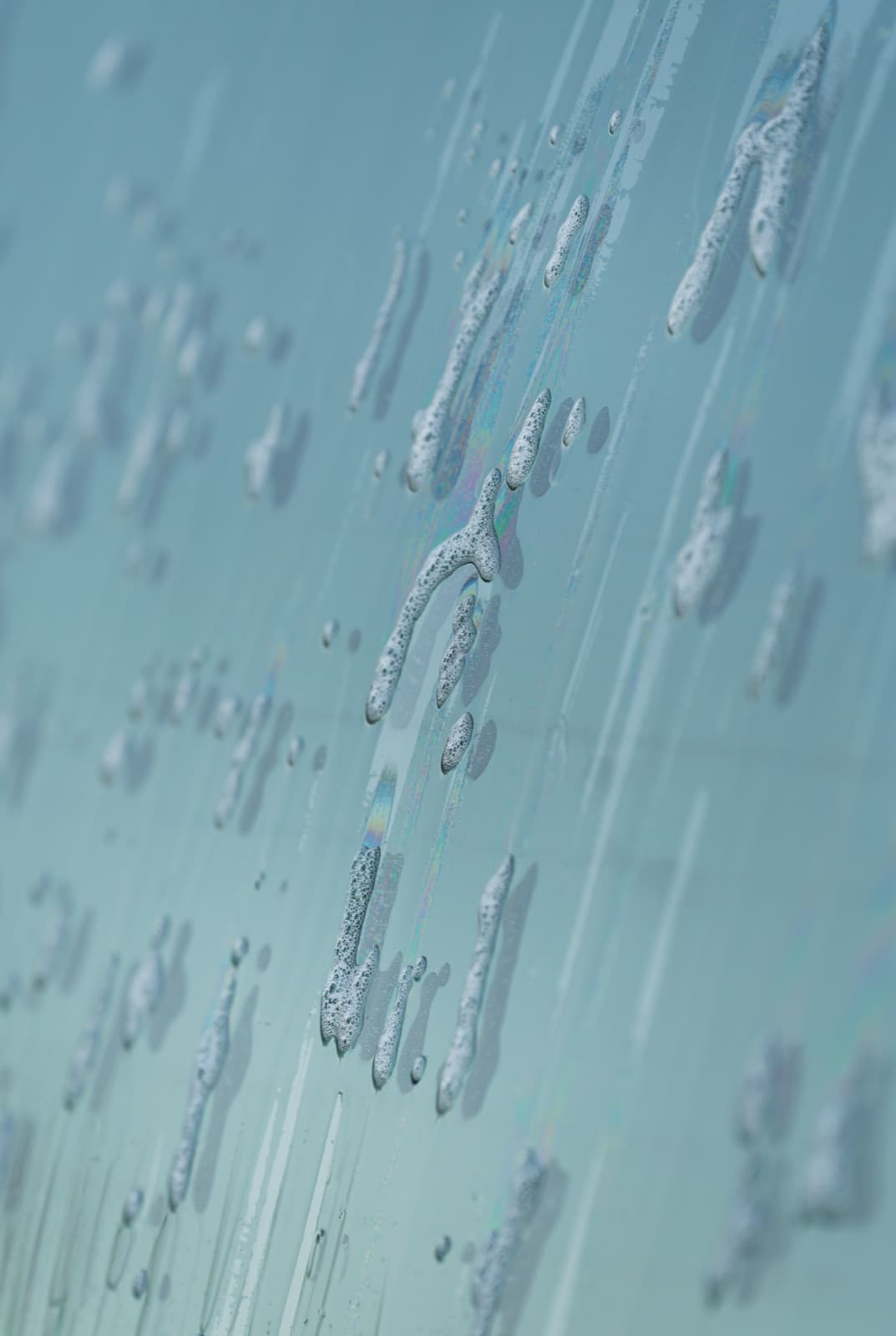 Close-up of soap bubbles on a freshly washed car — Johnson Car Wash, Kimironko